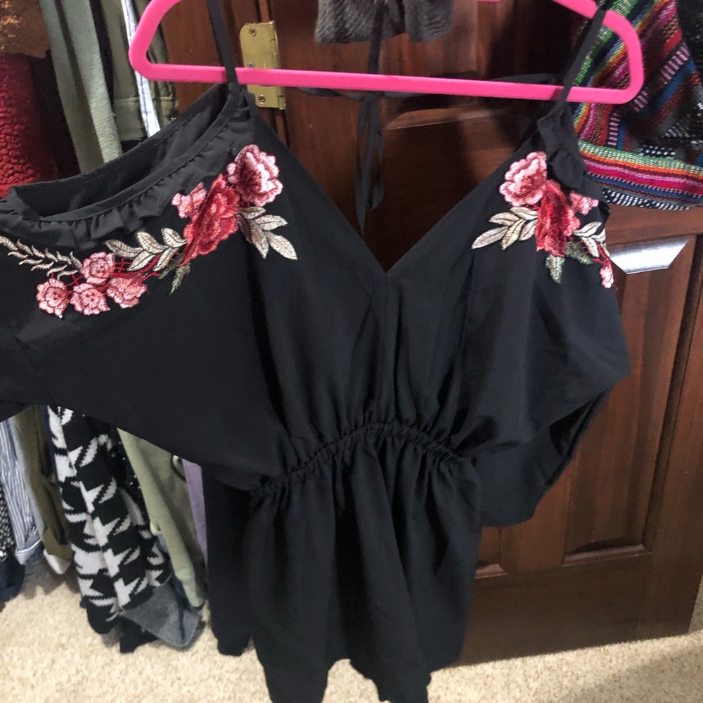 Adorable romper with floral detailing!